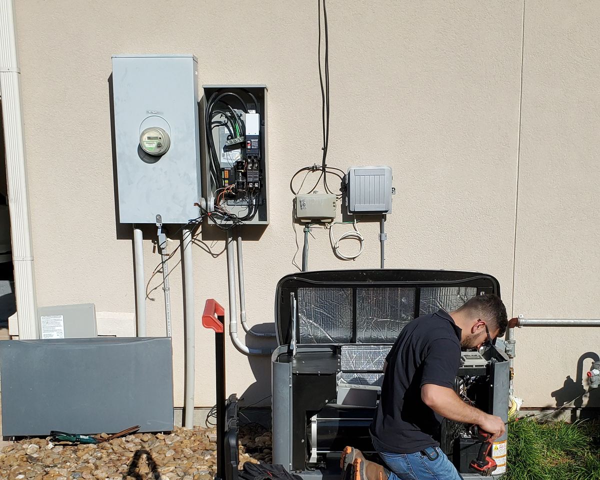 Bright Solutions Electrical technician working on a standby generator installation